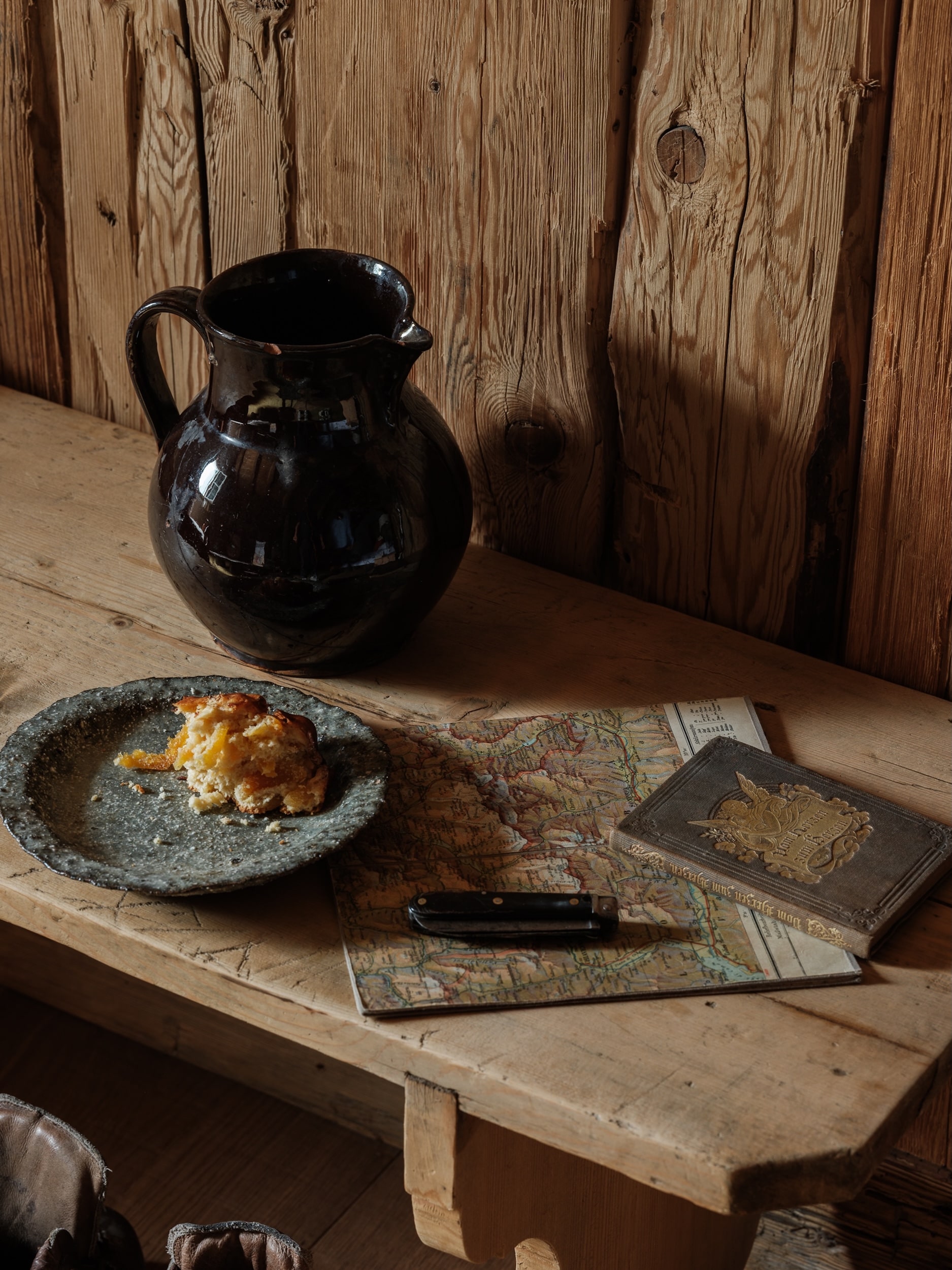a map and some cake on a table