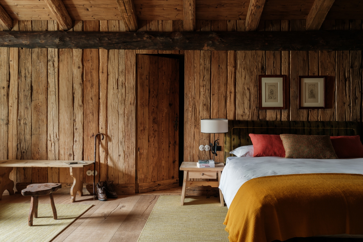 Chesa Family Suite Double bed in a wood cladded room